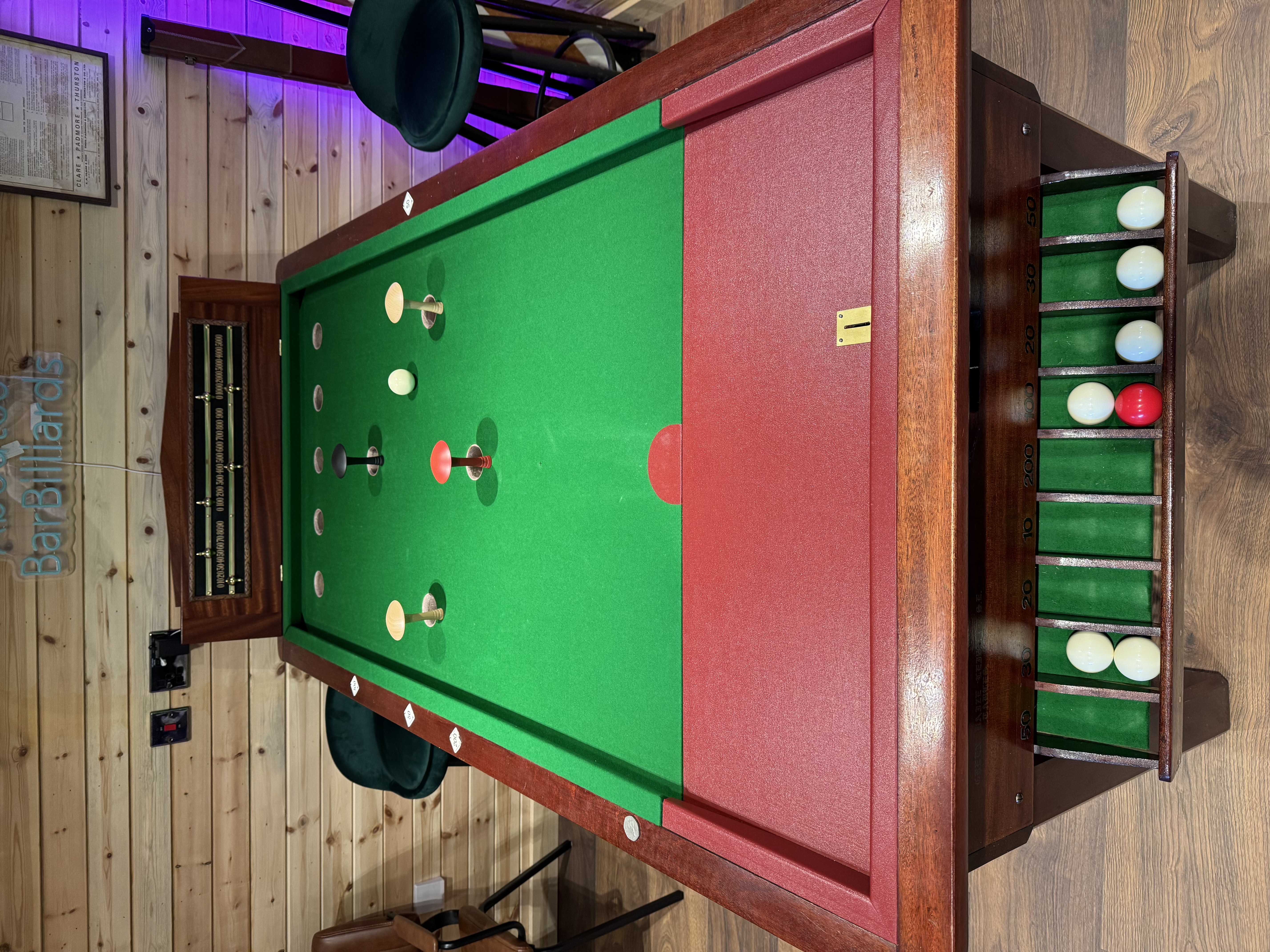 Restored four-pin bar billiards table playing surface