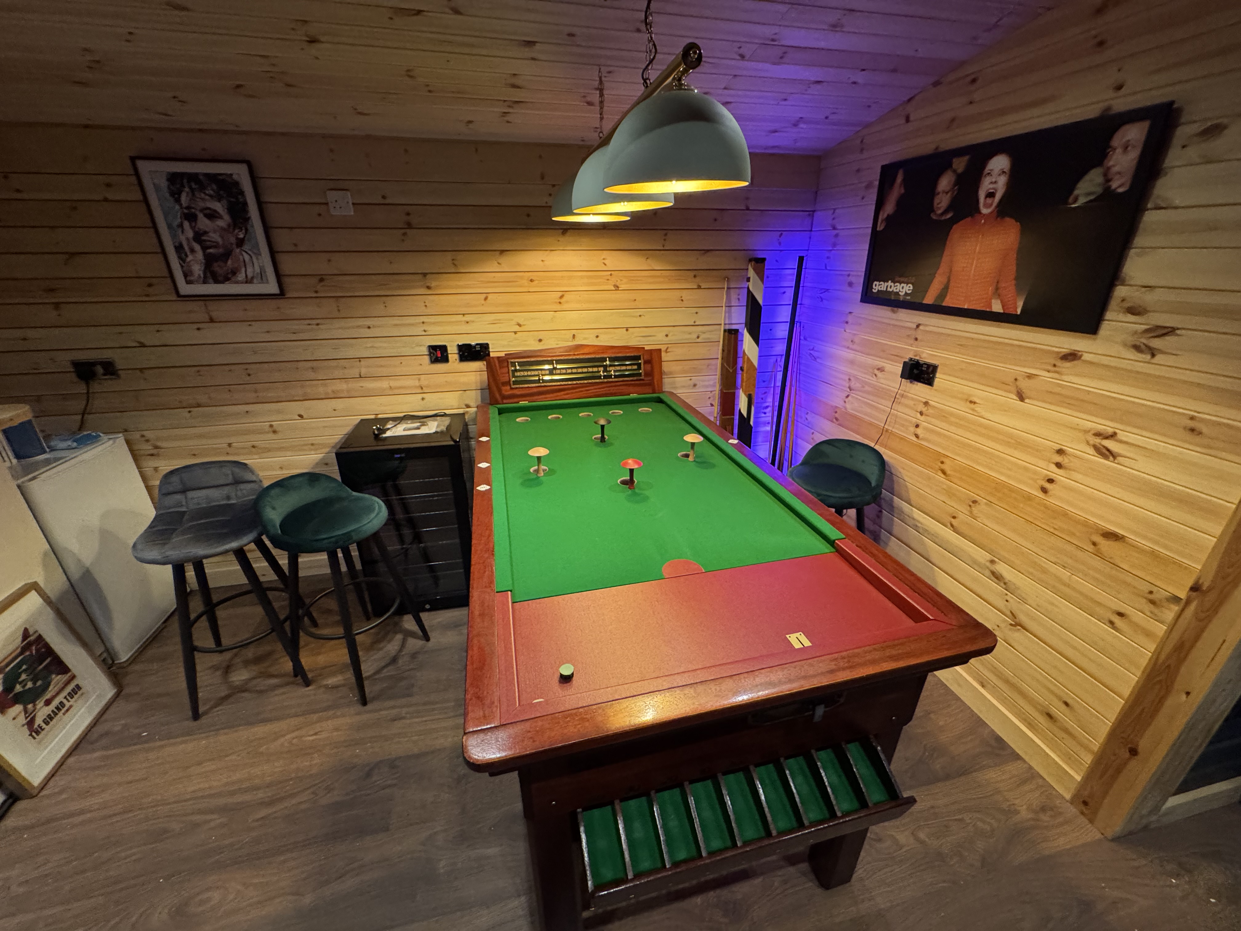 Bar billiards table installed against a wall